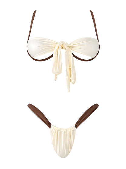 Nala krem ​​bikini set sa smeđim kontrastnim detaljima, senzualnim bandeau gornjim dijelom i visokim izrezanim donjim dijelom bikinija iz Becker's Amsterdam